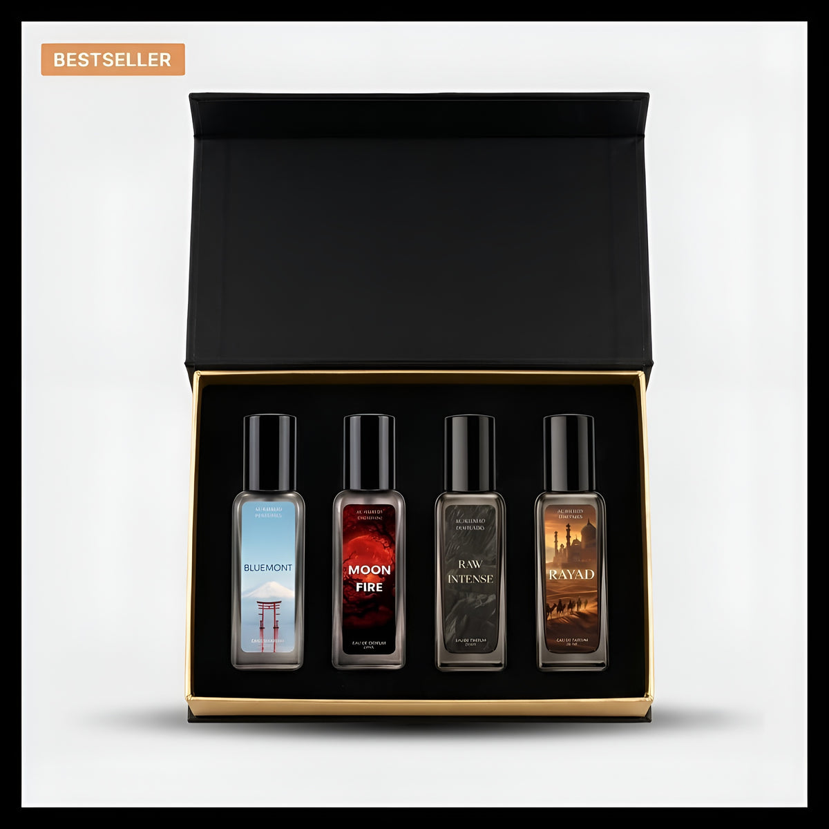 A boxed set of four small fragrance bottles displayed inside an open black gift box with a gold inner trim, on a light gray background. The set includes Bleu Mont, Moon Fire, R.